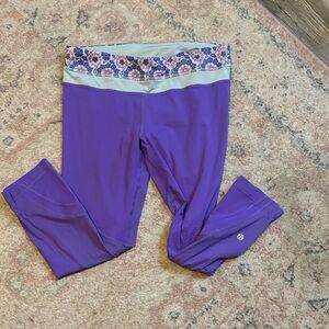 Lululemon Purple Active Leggings with Floral Waistband 23”inseam. Like new
